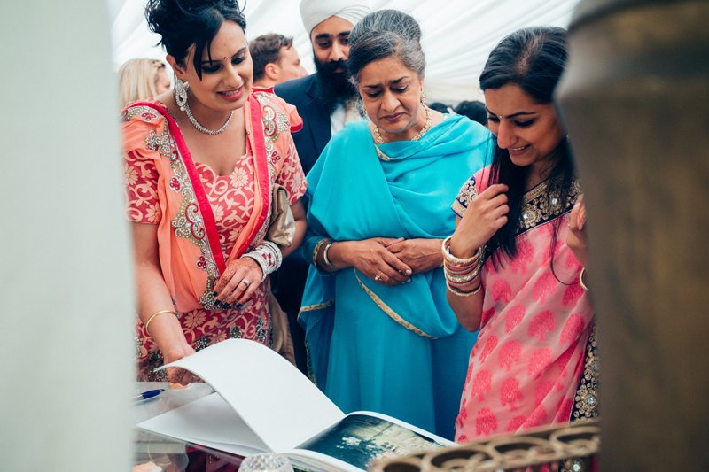looking through a guest book at the reception