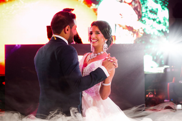 bride looking at camera during first dance 1