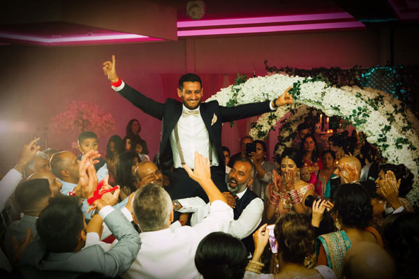 groom on shoulders during reception dancing 1