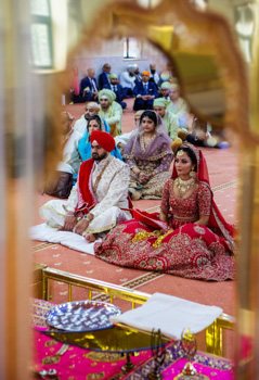 wedding couple sitting during anand karaj 1