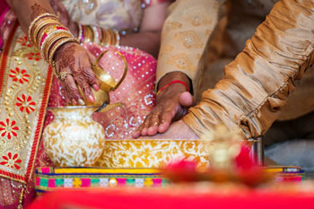 pooring water on grroms foot during hindu ceremony